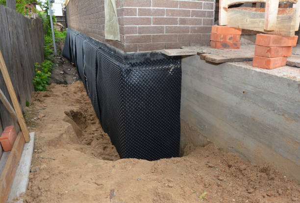 Happy homeowners after waterproofing job in Greens Fork